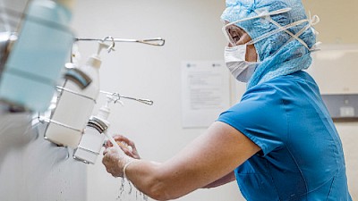 Surgeon scrubbing hands